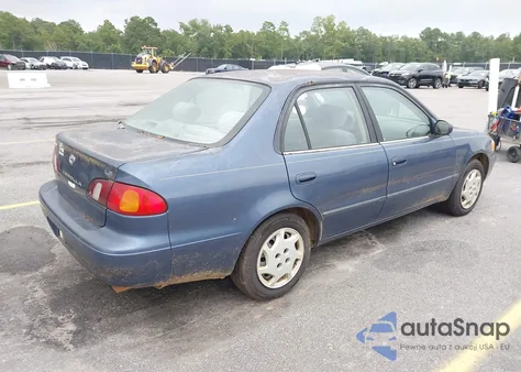 2000 Toyota Corolla Le z USA, uszkodzony, nr VIN 2T1BR12EXYC297082